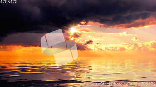 Image of dramatic ocean sunset sky background