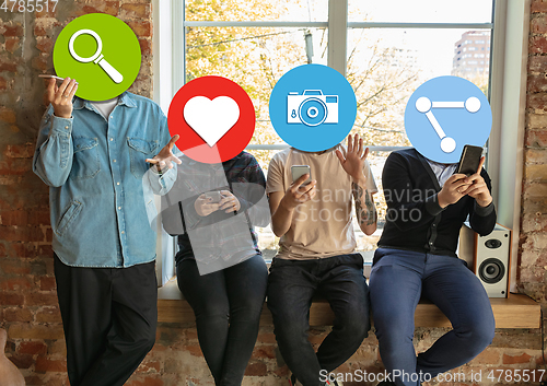 Image of Creative millenial people connecting and sharing social media. Modern UI icons as heads