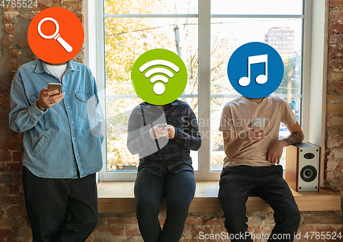 Image of Creative millenial people connecting and sharing social media. Modern UI icons as heads