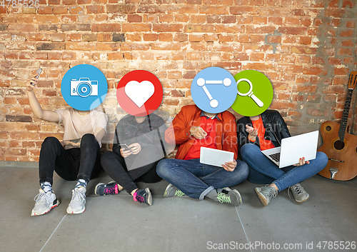 Image of Creative millenial people connecting and sharing social media. Modern UI icons as heads