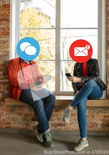 Image of Creative millenial people connecting and sharing social media. Modern UI icons as heads