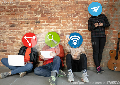 Image of Creative millenial people connecting and sharing social media. Modern UI icons as heads