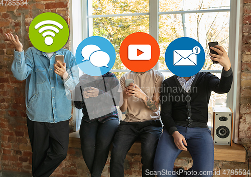 Image of Creative millenial people connecting and sharing social media. Modern UI icons as heads