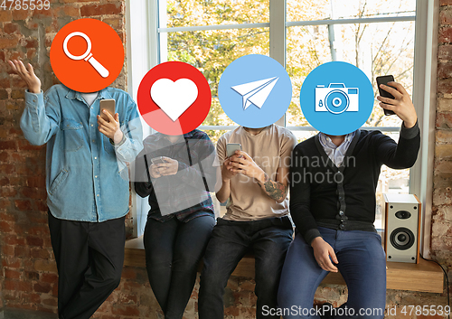 Image of Creative millenial people connecting and sharing social media. Modern UI icons as heads