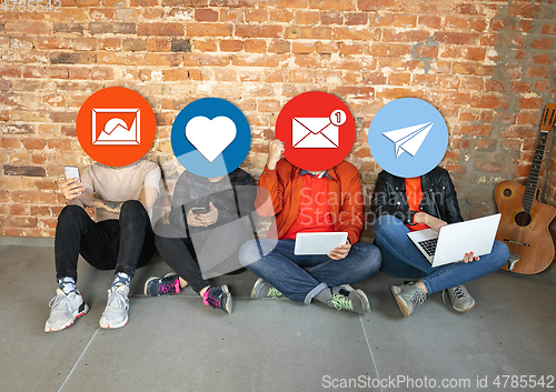 Image of Creative millenial people connecting and sharing social media. Modern UI icons as heads