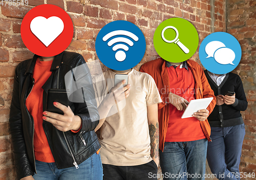 Image of Creative millenial people connecting and sharing social media. Modern UI icons as heads