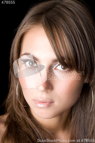 Image of Portrait of the young woman. Isolated on black 