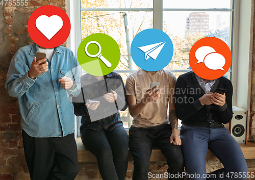 Image of Creative millenial people connecting and sharing social media. Modern UI icons as heads