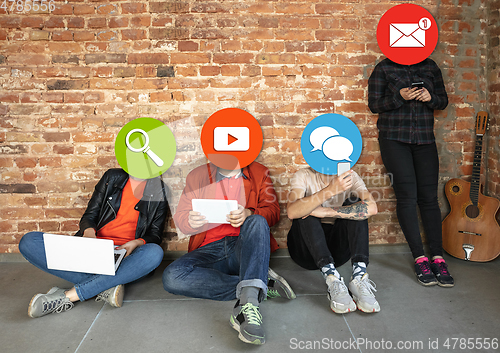 Image of Creative millenial people connecting and sharing social media. Modern UI icons as heads