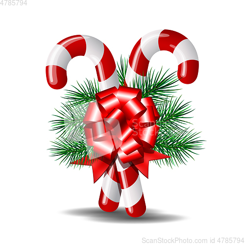 Image of Christmas candy canes with red bow isolated on white.