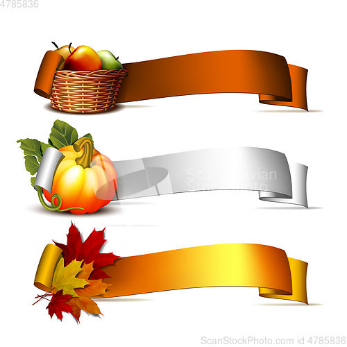 Image of ribbon with Orange pumpkins, Autumnal leaves and basket full ripe apples