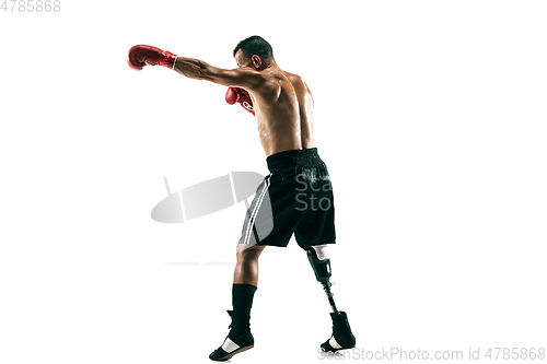 Image of Full length portrait of muscular sportsman with prosthetic leg, copy space. Male boxer in red gloves.