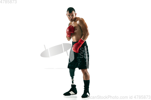 Image of Full length portrait of muscular sportsman with prosthetic leg, copy space. Male boxer in red gloves.