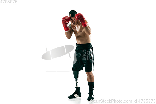 Image of Full length portrait of muscular sportsman with prosthetic leg, copy space. Male boxer in red gloves.