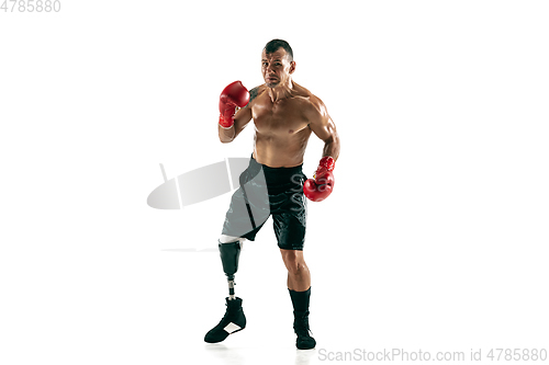 Image of Full length portrait of muscular sportsman with prosthetic leg, copy space. Male boxer in red gloves.