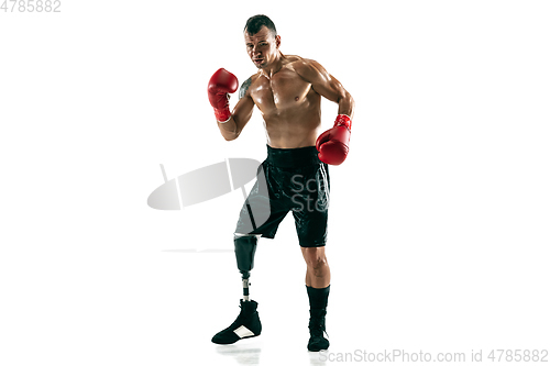 Image of Full length portrait of muscular sportsman with prosthetic leg, copy space. Male boxer in red gloves.