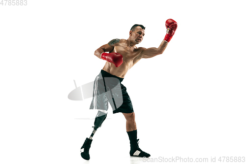 Image of Full length portrait of muscular sportsman with prosthetic leg, copy space. Male boxer in red gloves.