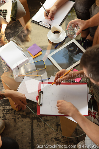 Image of Group of young caucasian office workers have creative meeting to discuss new ideas