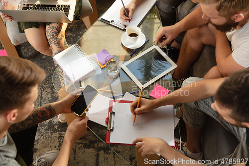 Image of Group of young caucasian office workers have creative meeting to discuss new ideas