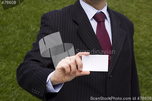 Image of Businessman showing a blank card