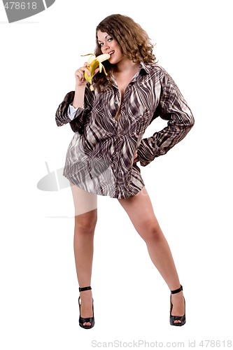 Image of young sexy beauty woman in a man's shirt with a banana. Isolated