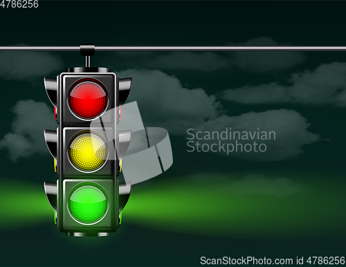 Image of Realistic traffic lights with green lamp on, hanging in night sky.