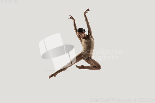 Image of Modern ballet dancer. Contemporary art ballet. Young flexible athletic woman.