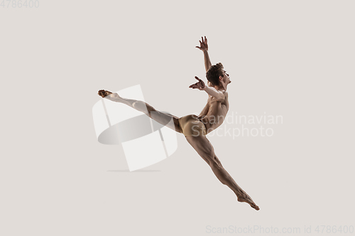 Image of Modern ballet dancer. Contemporary art ballet. Young flexible athletic man.