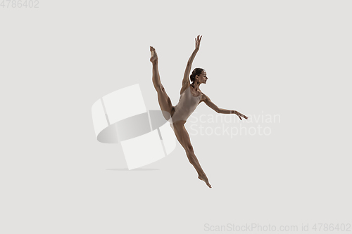 Image of Modern ballet dancer. Contemporary art ballet. Young flexible athletic woman.