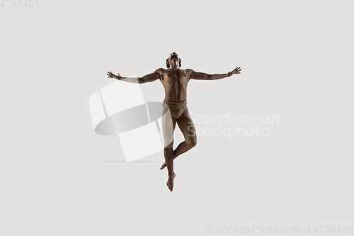 Image of Modern ballet dancer. Contemporary art ballet. Young flexible athletic man.