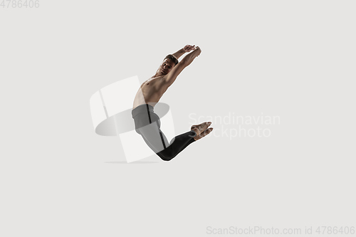 Image of Modern ballet dancer. Contemporary art ballet. Young flexible athletic man.