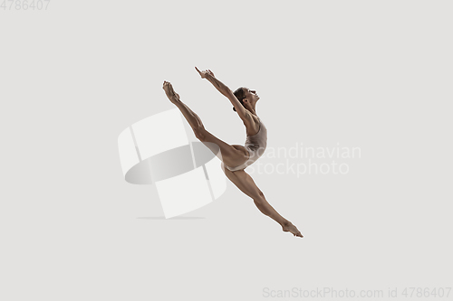 Image of Modern ballet dancer. Contemporary art ballet. Young flexible athletic woman.