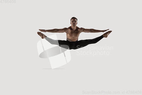 Image of Modern ballet dancer. Contemporary art ballet. Young flexible athletic man.