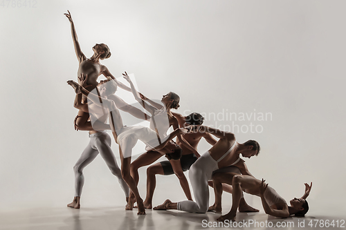 Image of The group of modern ballet dancers. Contemporary art ballet. Young flexible athletic men and women.