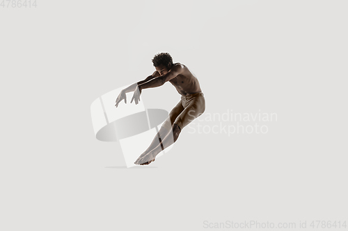 Image of Modern ballet dancer. Contemporary art ballet. Young flexible athletic man.