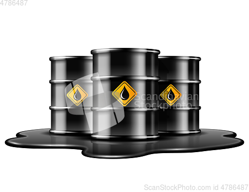 Image of Black barrels with oil drop label on spilled puddle of crude oil.