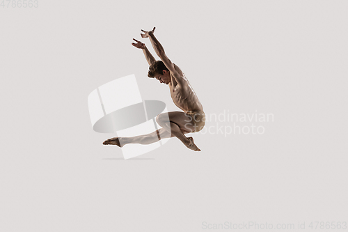 Image of Modern ballet dancer. Contemporary art ballet. Young flexible athletic man.