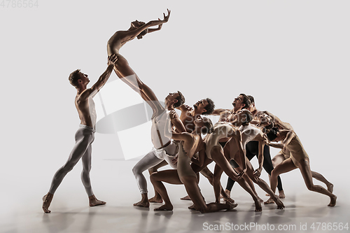 Image of The group of modern ballet dancers. Contemporary art ballet. Young flexible athletic men and women.