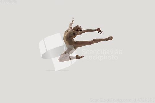 Image of Modern ballet dancer. Contemporary art ballet. Young flexible athletic woman.