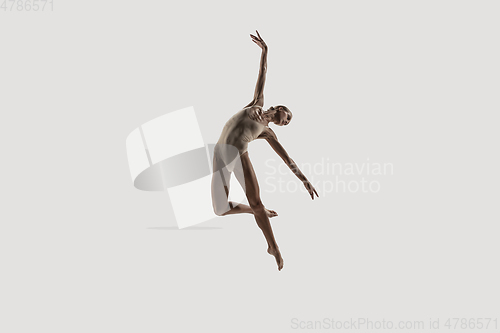 Image of Modern ballet dancer. Contemporary art ballet. Young flexible athletic woman.