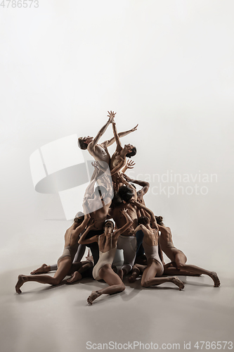 Image of The group of modern ballet dancers. Contemporary art ballet. Young flexible athletic men and women.
