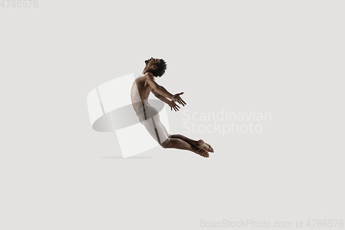 Image of Modern ballet dancer. Contemporary art ballet. Young flexible athletic man.