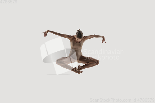 Image of Modern ballet dancer. Contemporary art ballet. Young flexible athletic woman.