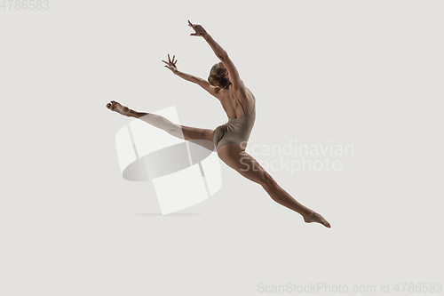 Image of Modern ballet dancer. Contemporary art ballet. Young flexible athletic woman.