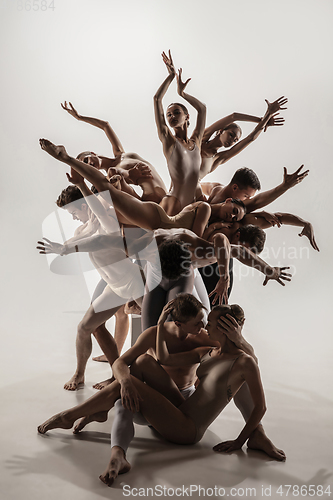 Image of The group of modern ballet dancers. Contemporary art ballet. Young flexible athletic men and women.