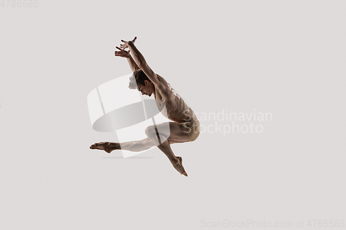 Image of Modern ballet dancer. Contemporary art ballet. Young flexible athletic man.