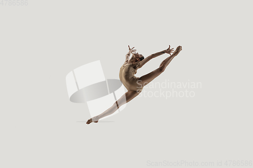 Image of Modern ballet dancer. Contemporary art ballet. Young flexible athletic woman.