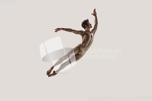 Image of Modern ballet dancer. Contemporary art ballet. Young flexible athletic man.