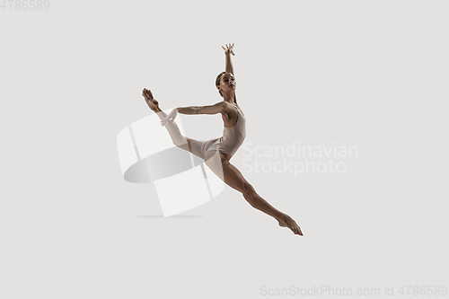 Image of Modern ballet dancer. Contemporary art ballet. Young flexible athletic woman.