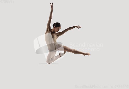 Image of Modern ballet dancer. Contemporary art ballet. Young flexible athletic woman.